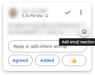 a screenshot of a Confluence comment thread that shows both an "Add emoji reaction" button and separately offers buttons for suggested replies, including "👍"