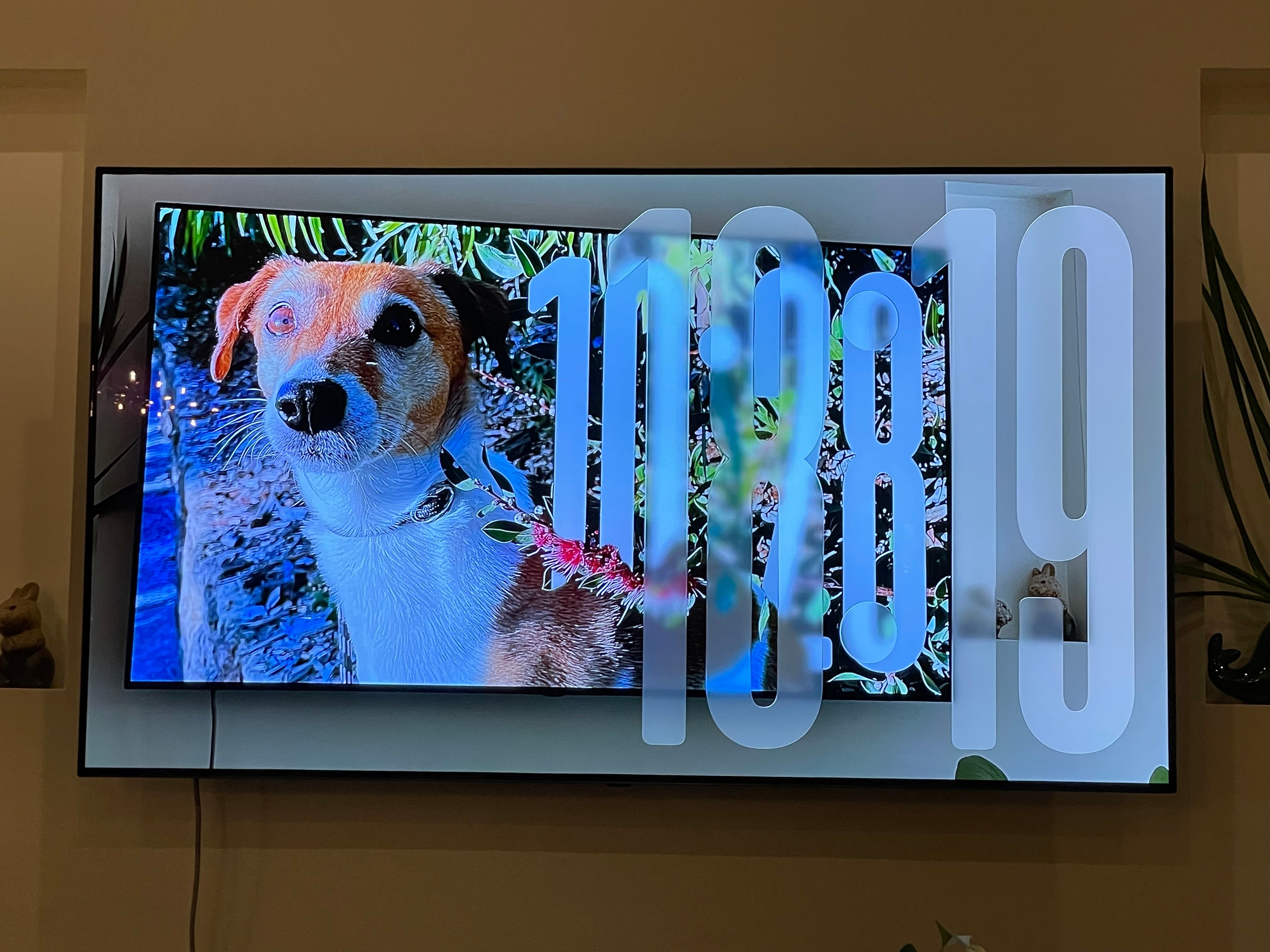 Photo of a TV showing the Apple tvOS 26 beta screensaver showing a photo of a TV showing the Apple tvOS 26 beta screensaver.