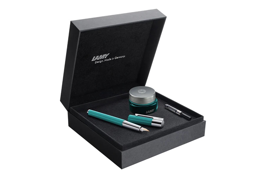 Product photo from Lamy showing a pen, ink bottle and converter in a hinged black box
